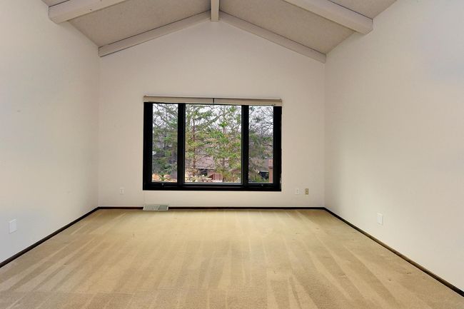 Freshly Painted Living Room off Foyer Entry features Vaulted Beamed Ceiling! | Image 18