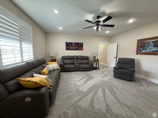 Living room with baseboards, carpet floors, ceiling fan, and recessed lighting | Image 51