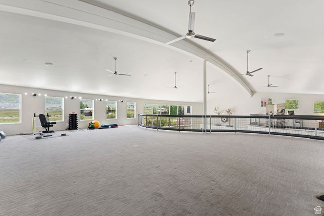 Interior space featuring lofted ceiling, ceiling fan, and healthy amount of natural light | Image 31