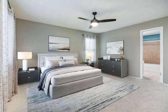 Carpeted bedroom with baseboards, ensuite bath, and a ceiling fan | Image 4