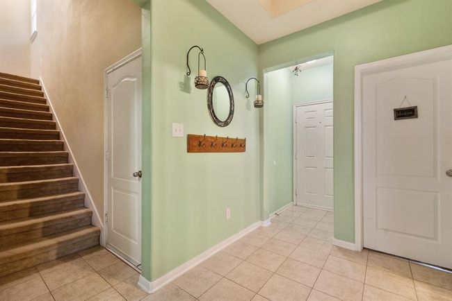 The entryway to the home also has the staircase to the second floor. | Image 5