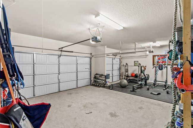Garage with a garage door opener | Image 28