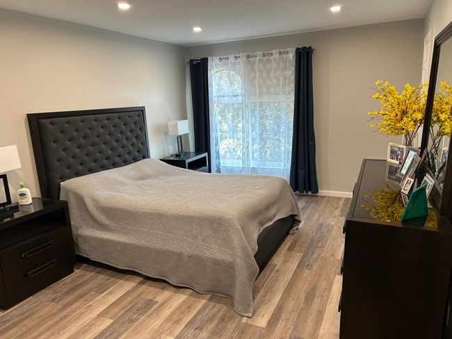 Bedroom featuring recessed lighting and wood finished floors | Image 33