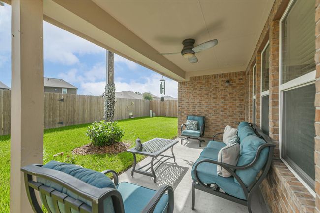 Relax in your back patio or enjoy a nice walk with direct gate access to the Forest Village greenbelt from your backyard. | Image 35