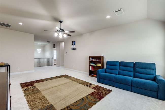 Living room featuring a ceiling fan, carpet flooring, and recessed lighting | Image 15