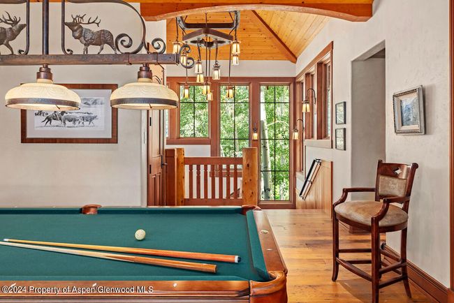 Wormy chestnut floors throughout house continued through this space. | Image 40