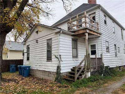 View of rear property exterior featuring a balcony | Image 3