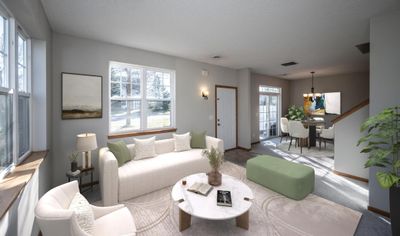 Bright light-filled living room and dining area. | Image 3