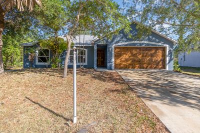 1058 Lava Street Se, House other with 3 bedrooms, 2 bathrooms and null parking in Palm Bay FL | Image 1