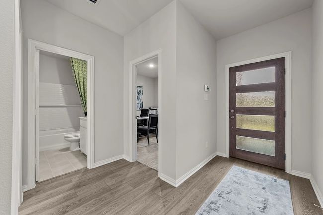 Foyer entrance featuring wood finished floors and baseboards | Image 11