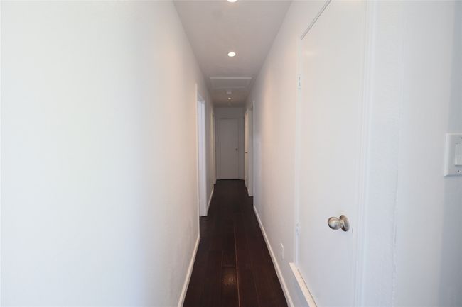 Corridor featuring dark wood-style floors and recessed lighting | Image 18