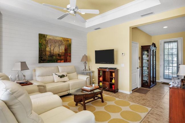Living Room with tray ceilings and ship lap wall | Image 10