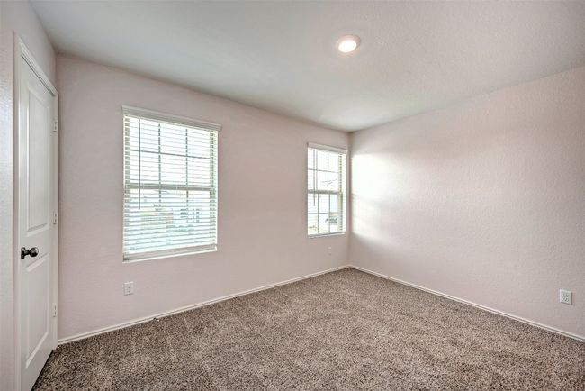 Carpeted spare room with baseboards | Image 28