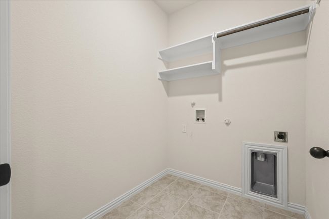 Laundry area featuring hookup for a gas dryer, electric dryer hookup, and washer hookup | Image 20