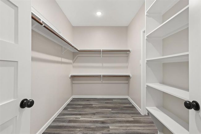 HUGE walk in closet in the primary suite which leads to the laundry room | Image 21