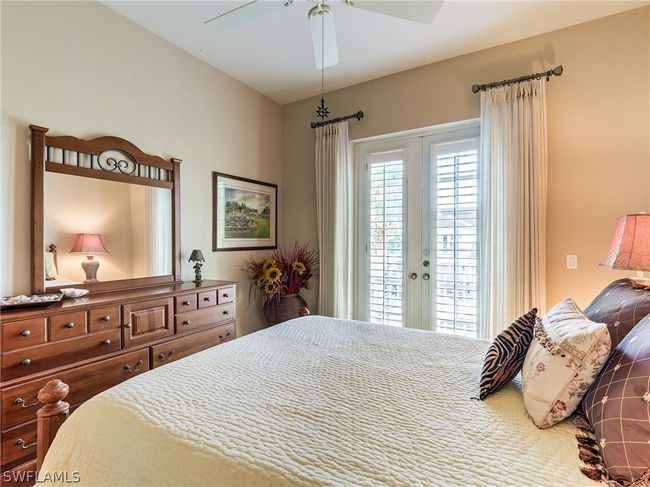 Bedroom featuring ceiling fan, french doors, and access to outside | Image 25