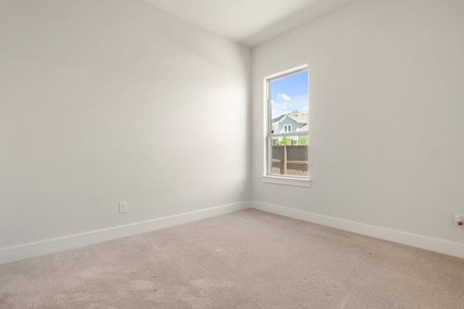 Spare room featuring baseboards and light carpet | Image 19