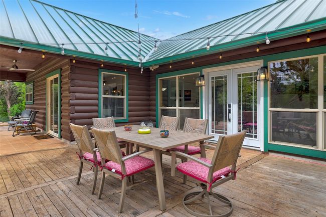 Wooden deck featuring outdoor dining area | Image 32