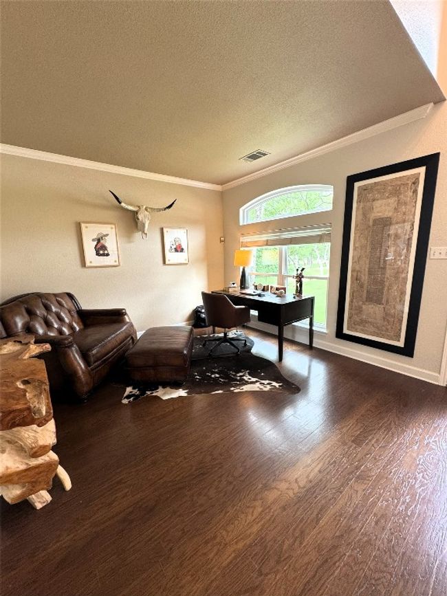 Office area with ornamental molding, .wood finished floors, and a textured ceiling | Image 17