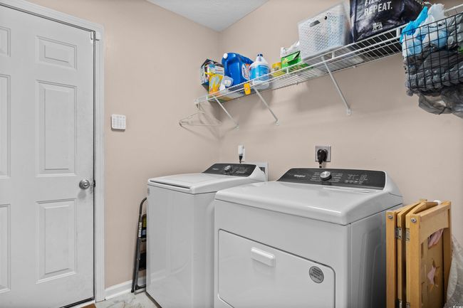 Washroom featuring independent washer and dryer and baseboards | Image 16