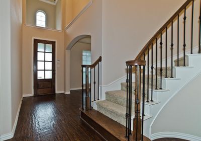 View Of Front Entry From Dramatic Stairwell | Image 2