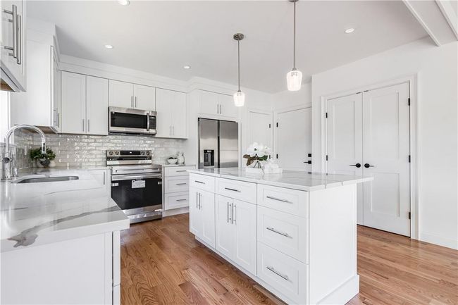 Unit #1: Left side, offers two pantry's and access to your 1 car garage. | Image 6