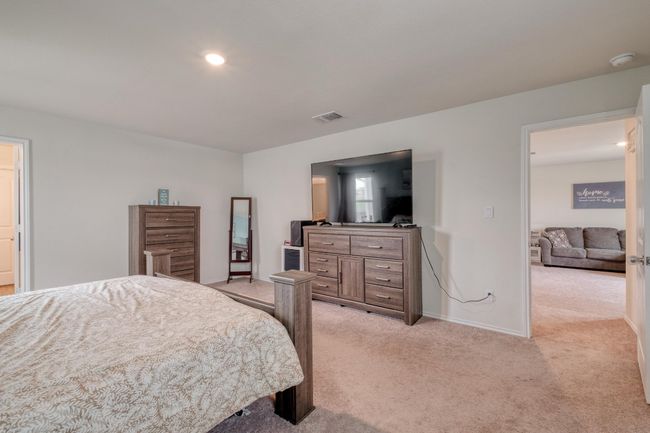 Bedroom featuring baseboards, visible vents, recessed lighting, and light colored carpet | Image 24