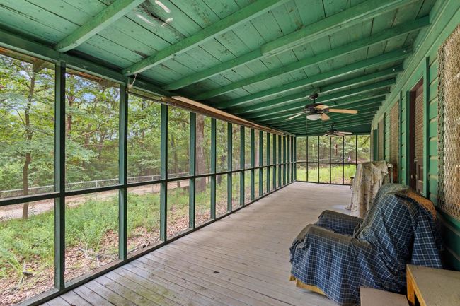 Sunroom with ceiling fan and beam ceiling | Image 17