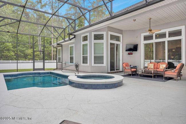 Pool/heated spa/covered living/tv space | Image 39