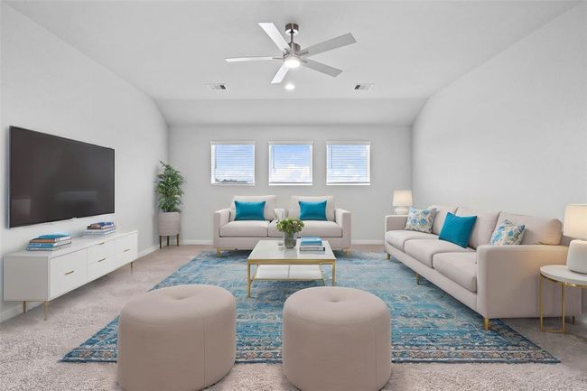 Come upstairs and enjoy a day of leisure in this fabulous game room! This is the perfect hangout spot or adult game room, this space features plush carpet, high vaulted ceiling, ceiling fan, recessed lighting, custom paint and large windows with privacy blinds. | Image 13