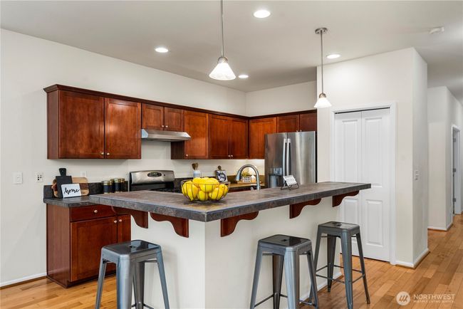 sprawling kitchen/dining area flows seamlessly out to the back patio and into the large living room! | Image 10