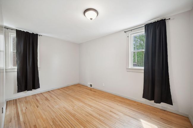 Beautiful hardwood floors in 2nd main floor bedroom | Image 13