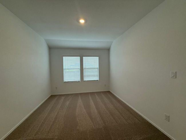 Carpeted spare room with baseboards and vaulted ceiling | Image 14