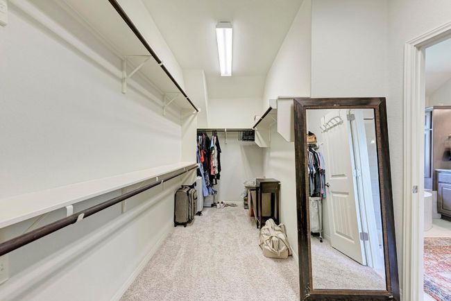 The owner's walk-in closet wrap around behind one vanity, offering lots of storage potential. | Image 28