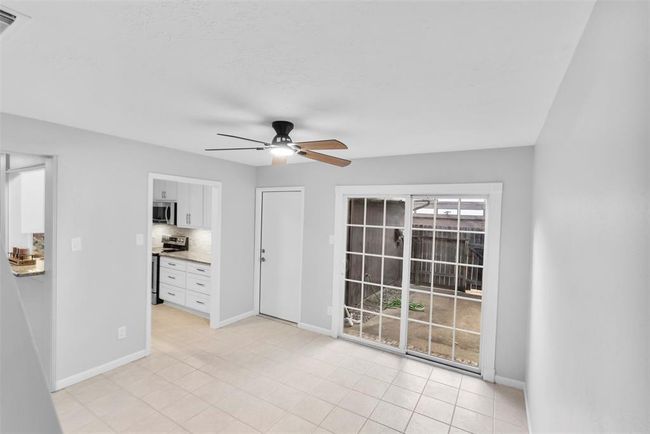 The dining room can offer plenty of space for family & friends to relax & socialize. | Image 14