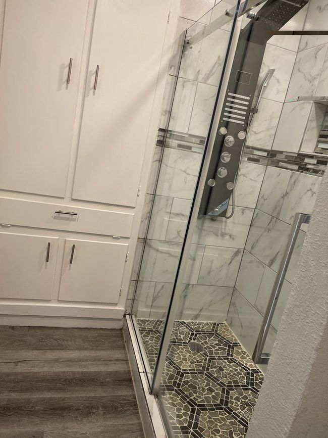 Bathroom with hardwood / wood-style floors and an enclosed shower | Image 5