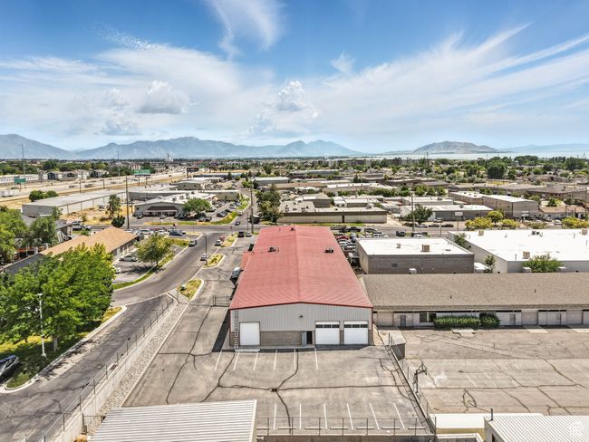 Aerial view of residential area featuring a mountainous background | Image 4