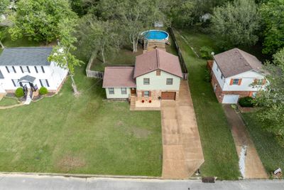 Aerial view shows the Amazing yard & expansive aggregate driveway | Image 3