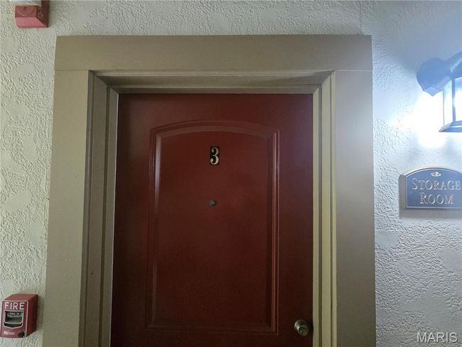 Door to storage area on lower level | Image 23
