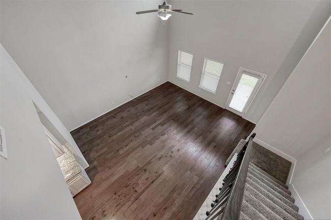 Spacious family room with high ceiling, hardwood floors, ample natural light; ideal for sectional furniture and an entertainment center.... | Image 19