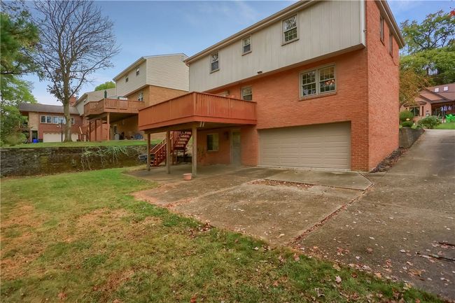 Rear parking pad and garage | Image 4