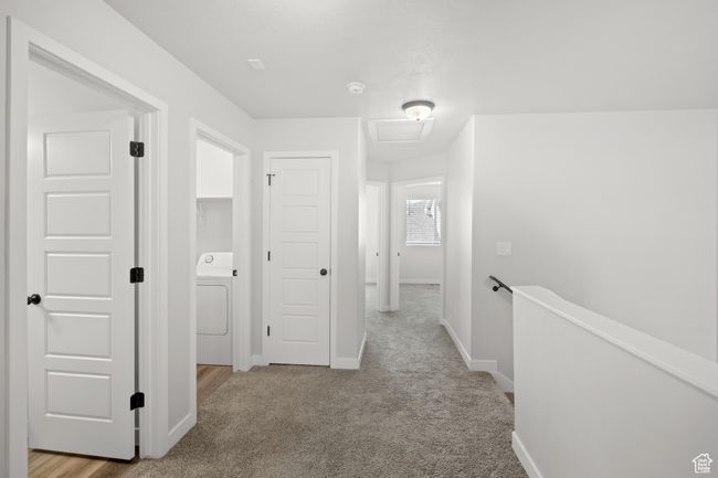 Hall with washer / dryer, carpet, and an upstairs landing | Image 27