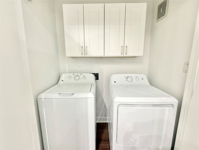 Washroom with separate washer and dryer and cabinet space | Image 9