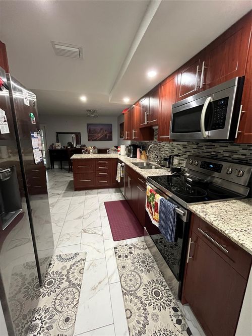 16-16 Spinning Wheel Ln, Tamarac, FL, 33319-2482 | Card Image