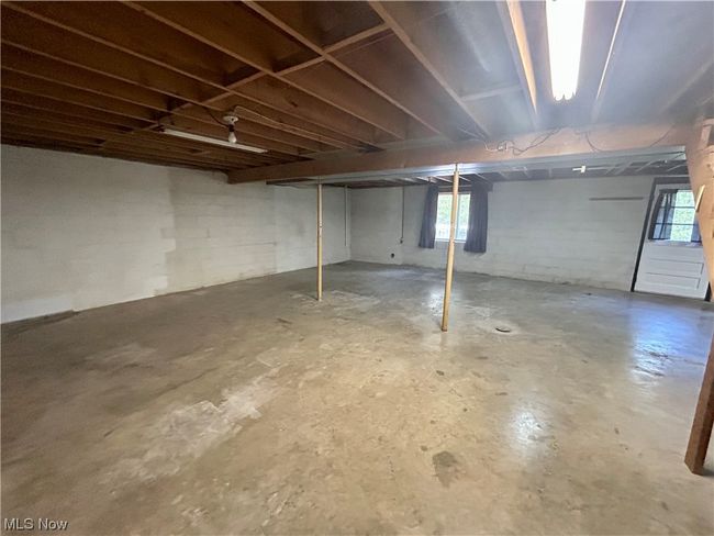 Basement featuring plenty of natural light | Image 19