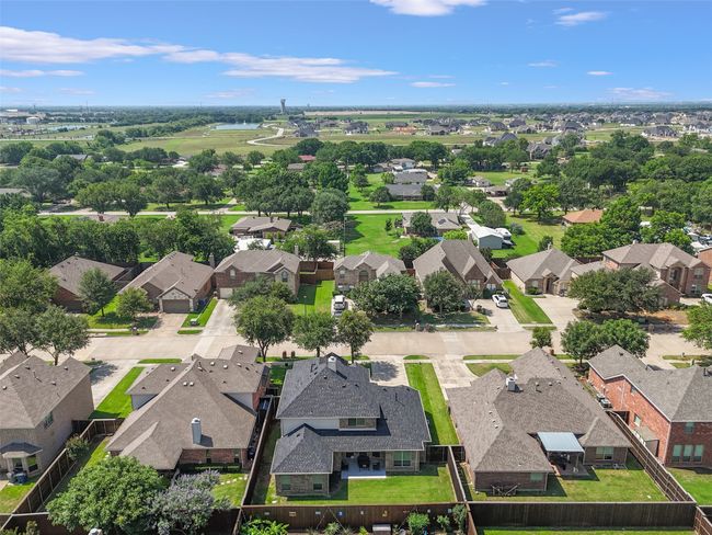 Aerial perspective of suburban area with a nearby body of water | Image 35