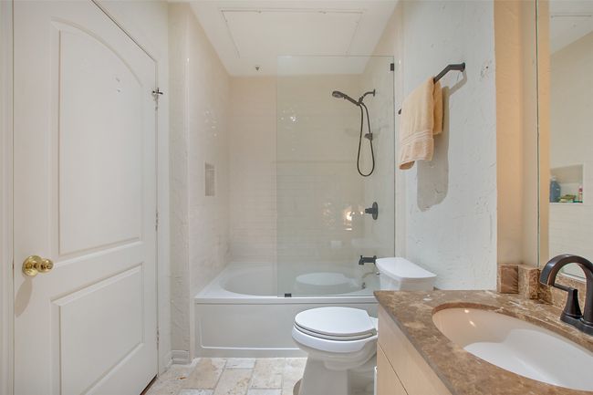 Full bath with vanity, toilet, and shower / bath combination | Image 16