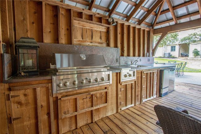 Wooden deck featuring area for grilling | Image 28