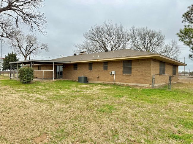 Back of house with a yard and central air condition unit | Image 10
