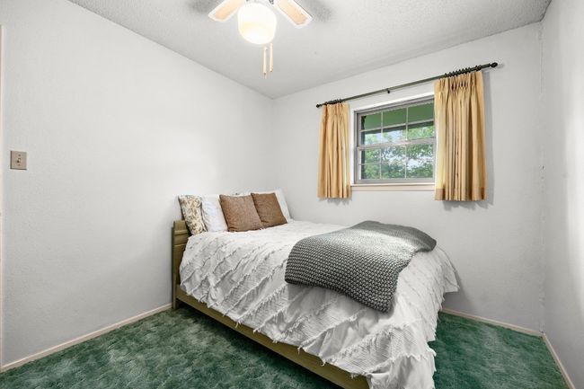 Carpeted bedroom featuring baseboards and a ceiling fan | Image 20